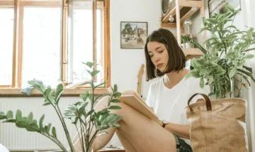 A woman sitting in her room